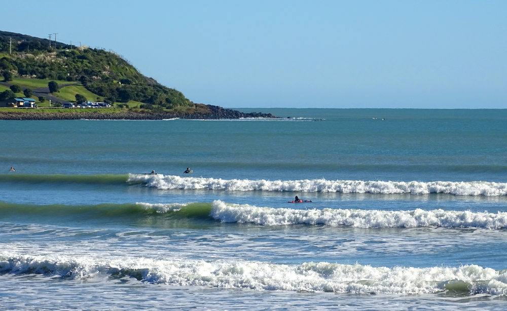 Surfing at Ngarunui Beach in Raglan,